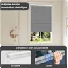 A window with a gray pleated blind, and a comparison of suction cups below. Produktbild-Vorschau