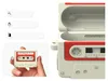 A hand holding a retro cassette tape shaped case for Apple AirPods Pro. Produktbild-Vorschau