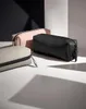 Three accessory cases are arranged on a white surface with a black and white background. Voir les images du produit