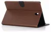 A brown leather tablet case is shown standing upright, propped open. Produktbild-Vorschau