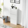 A white shoe cabinet with three flip-down drawers is shown in a room with a window and a rug. Anteprima dell’immagine prodotto