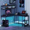A gaming desk setup with a computer, monitor, speakers, and accessories, illuminated by LED lights. Náhľad obrázku produktu