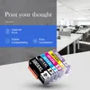 Printer ink cartridges displayed in front of a modern office setting. Produktbild-Vorschau