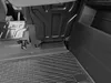 A close-up view of the interior of a vehicle, showing a black rubber floor mat and the underside of a seat. Produktbild-Vorschau