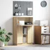 A home office setup with a desk, storage unit, and a plant. Anteprima dell’immagine prodotto
