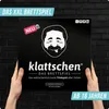 A person is holding a board game box with a cartoon face and text on it. Produktbild-Vorschau