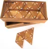 A wooden puzzle game with numbered triangular pieces is shown in a wooden box, with some pieces laid out in front. Podgląd zdjęcia produktu