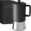 A black and silver stovetop espresso maker next to its packaging. Produktbild-Vorschau