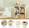A living room scene with a sofa and a bookshelf. Produktbild-Vorschau