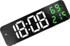 A digital alarm clock displaying the time, humidity, and temperature. Voir les images du produit