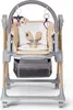 A baby high chair with a storage basket underneath and toys hanging from the arch. Náhled obrázku produktu