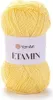A ball of yellow yarn with a white label. Produktbild-Vorschau