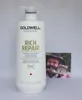 A large white bottle of Goldwell Dualsenses Rich Repair Restoring Conditioner is shown in front of a white background, with a small photograph of a man to the right. Produktbild-Vorschau