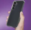 A hand holding a clear phone case with a Samsung Galaxy A36 5G phone inside, against a purple background. Anteprima dell’immagine prodotto