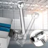 A close-up view of a precision machine vise with a handle in motion, set against a blurred industrial background. Náhled obrázku produktu