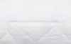 A close-up view of a white quilted pillow with a zipper. Produktbild-Vorschau