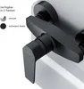 A close-up of a black shower faucet with text indicating available colors. Produktbild-Vorschau