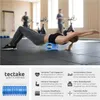 A woman is using a blue foam roller in a gym setting. The image is split into a main photo and a lower section with product details and branding. Produktbild-Vorschau