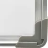 A close-up view of the corner of a whiteboard, showing the white surface, silver frame, and gray corner protector. Produktbild-Vorschau