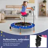 A young girl is jumping on a blue trampoline with LED lights in a living room. Náhled obrázku produktu