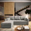 A modern living room with a sectional sofa, fireplace, and staircase. Produktbild-Vorschau