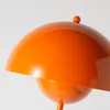 A close-up shot of an orange lamp. Podgląd zdjęcia produktu