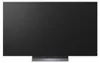 A front view of a modern black television set on a stand. Podgląd zdjęcia produktu
