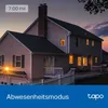 A house at dusk with lights on, suggesting a smart home feature. Produktbild-Vorschau
