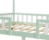 Close-up view of a children's bed frame with a house-like structure and safety rails. Produktbild-Vorschau