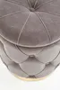 Close-up view of a tufted ottoman. Produktbild-Vorschau