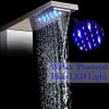A close-up of a modern shower head with water flowing and blue LED lights. Náhled obrázku produktu