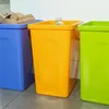 Three colorful recycling bins are lined up on a floor. Produktbild-Vorschau