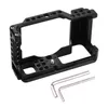 A black aluminum camera cage rig with two hex wrenches on a white background. Náhled obrázku produktu