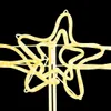 A close-up of a yellow star-shaped Christmas decoration with lights against a black background. Anteprima dell’immagine prodotto