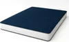 A dark blue mattress with a white quilted side, shown on a white background. Náhľad obrázku produktu