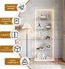 A display cabinet with LED lighting, showcasing decorative items and books. Produktbild-Vorschau