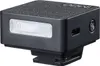 A black on-camera flash unit is shown against a white background. Podgląd zdjęcia produktu