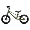 A green balance bike on a white background. Produktbild-Vorschau