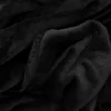 A close-up view of a black plush blanket, showing its soft texture and folded layers. Produktbild-Vorschau