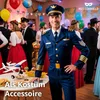 A man in a pilot costume stands at a party with other people in the background and a small airplane model on a table. Anteprima dell’immagine prodotto