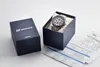 A Casio Edifice watch is presented in its original packaging, alongside its warranty card and instruction manual. Produktbild-Vorschau