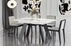 A modern dining table with four chairs in a well-lit room. Anteprima dell’immagine prodotto