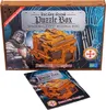 The image shows the packaging of a 3D wooden puzzle box with a knight and a mechanical model of the box on it. A separate booklet showing the puzzle box is also visible. Produktbild-Vorschau