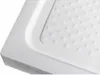 A close-up, angled view of a white shower tray with a textured surface. Náhled obrázku produktu