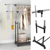 A collage showing a double-tiered clothing rack with clothes hanging on it, along with close-ups of the assembly joints and the base. Anteprima dell’immagine prodotto
