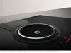 Close-up of a black induction cooktop with a built-in ventilation system. Náhled obrázku produktu