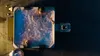 An aerial view of people relaxing in a hot tub at night. Produktbild-Vorschau