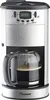 A front-facing image of a Bestron coffee maker with a glass carafe filled with coffee. Voir les images du produit