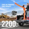 A pickup truck with an orange crane lifting an engine, with construction equipment in the background. Anteprima dell’immagine prodotto