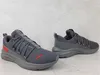 A pair of gray Puma sneakers with red accents are displayed against a light gray background. Produktbild-Vorschau
